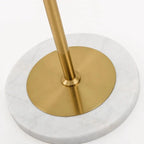 Close Up View of White Marble Base and Brass Pole Connection