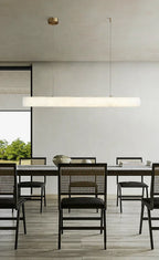 Modern Linear Alabaster Pendant Light Over Dining Room Table