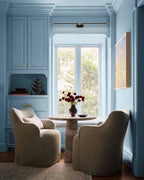 Modern Black Wall Sconce in Cozy Blue Living Area