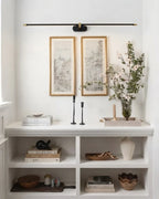 Modern Black Picture Light Over Framed Art in Hallway