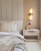 Modern Dual-Cylinder Wall Sconce in Bedroom Setting
