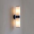 Illuminated Modern Dual-Cylinder Wall Sconce with Black Frame Studio Display