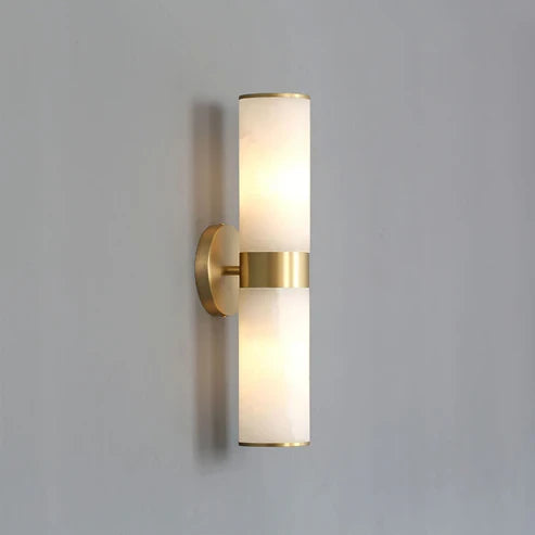 Illuminated Modern Alabaster Style Wall Sconce on Grey Background