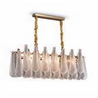 Modern Rope-Hung Brass Linear Chandelier with Ice Glass Drops on Pure White Background