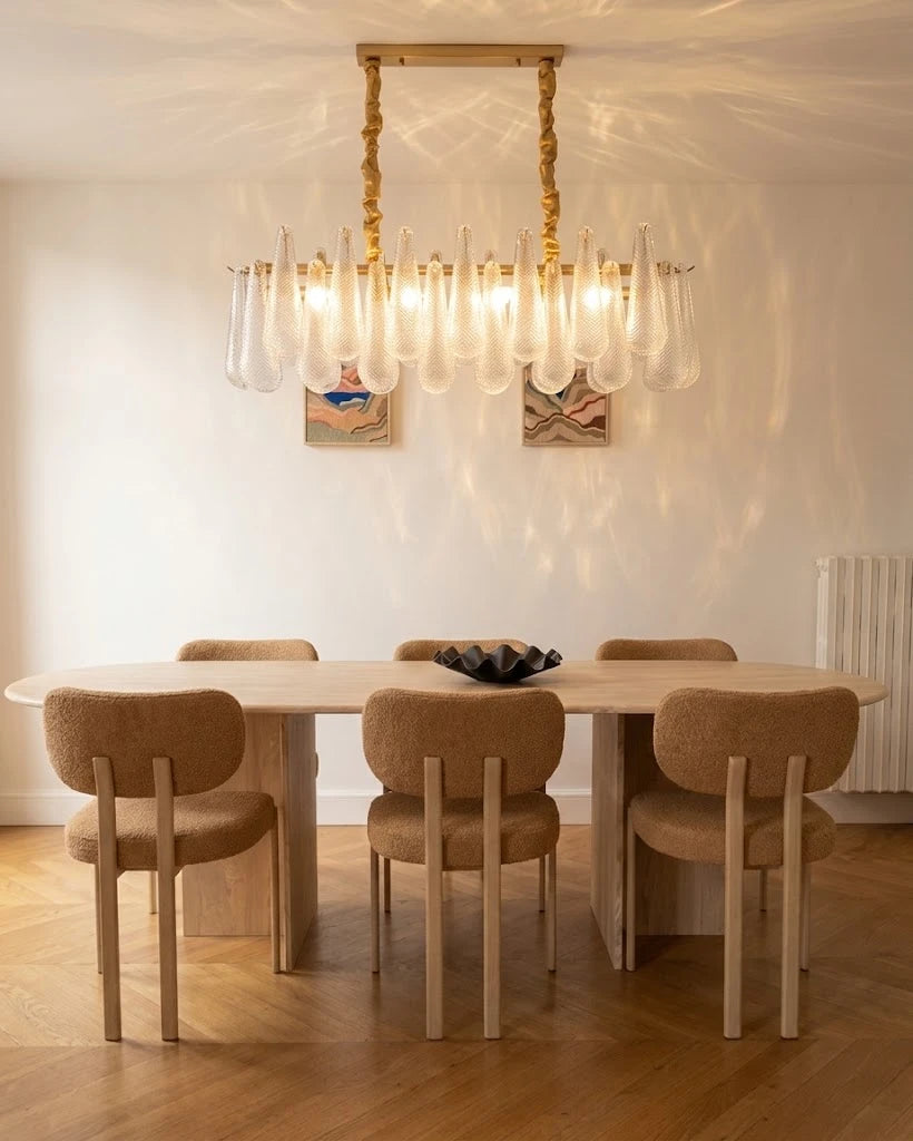 Modern Linear Chandelier Over Dining Table in Minimalist Setting