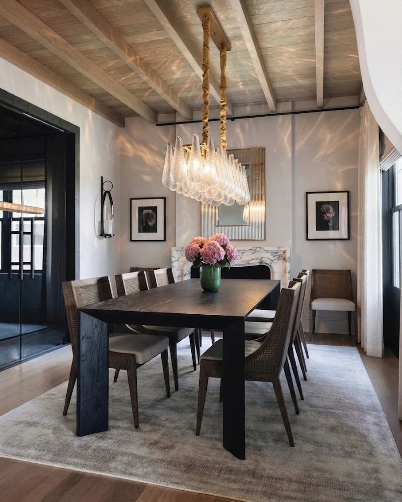 Modern Brass Linear Chandelier Over Dining Room Table