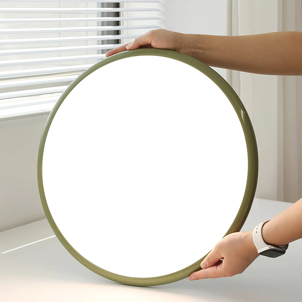 Hands Holding Modern Green Ultra-Thin Round Ceiling Light Fixture