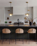 Modern Black and Gold Pendant Lights Over Kitchen Island