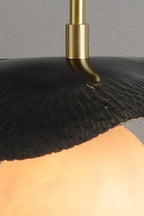 Close Up View of Black Disc Shade and Brass Rod Connection