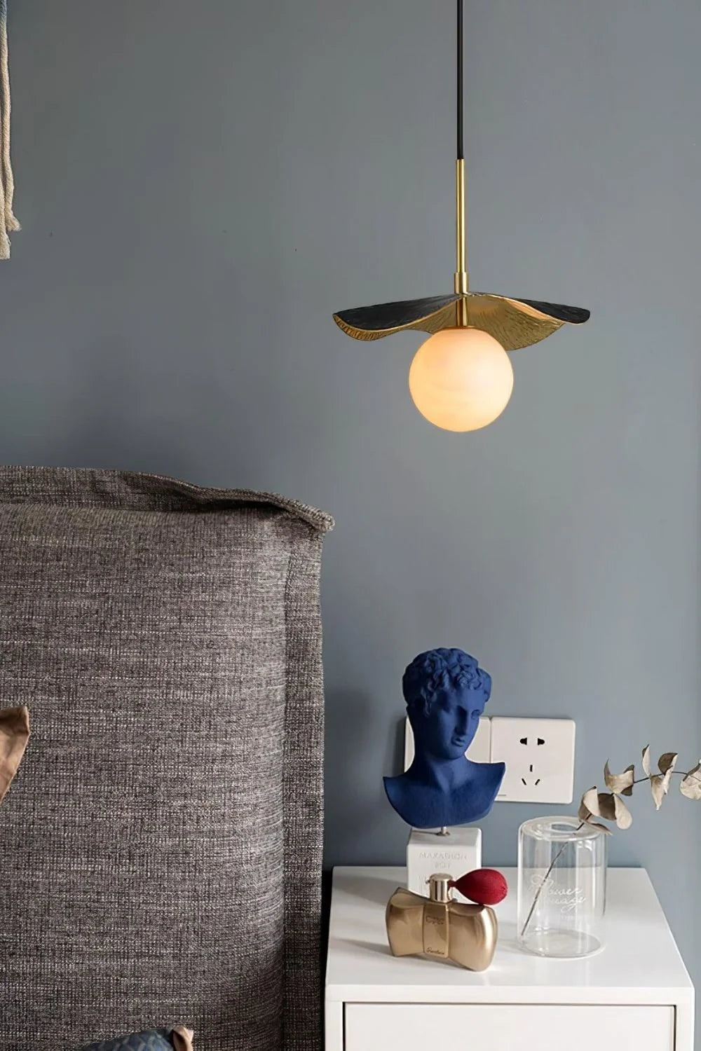 Modern Black Disc Pendant Light in Bedroom Interior