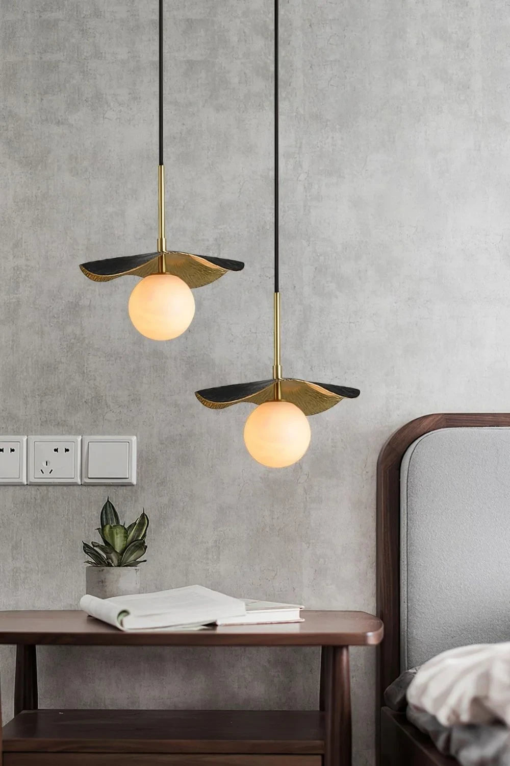 Modern Black and Gold Pendant Lights Over Bedroom Setting