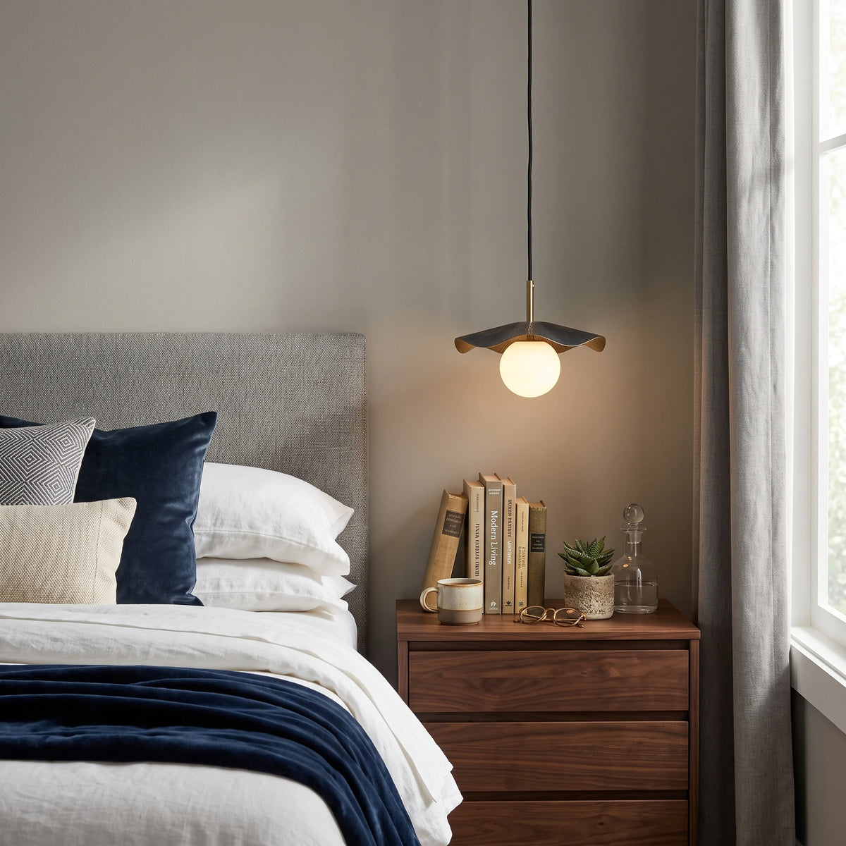 Modern Black and Gold Pendant Light Over Bedroom Nightstand