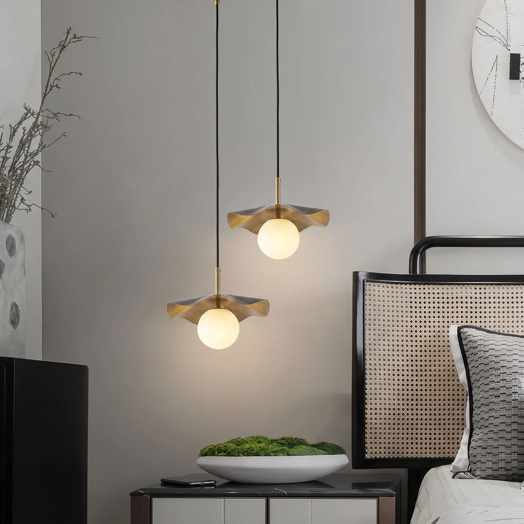 Modern Black and Gold Pendant Lights Over Master Bedside
