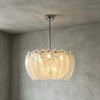 Illuminated Modern Petal Art Glass Chandelier on Textured Wall