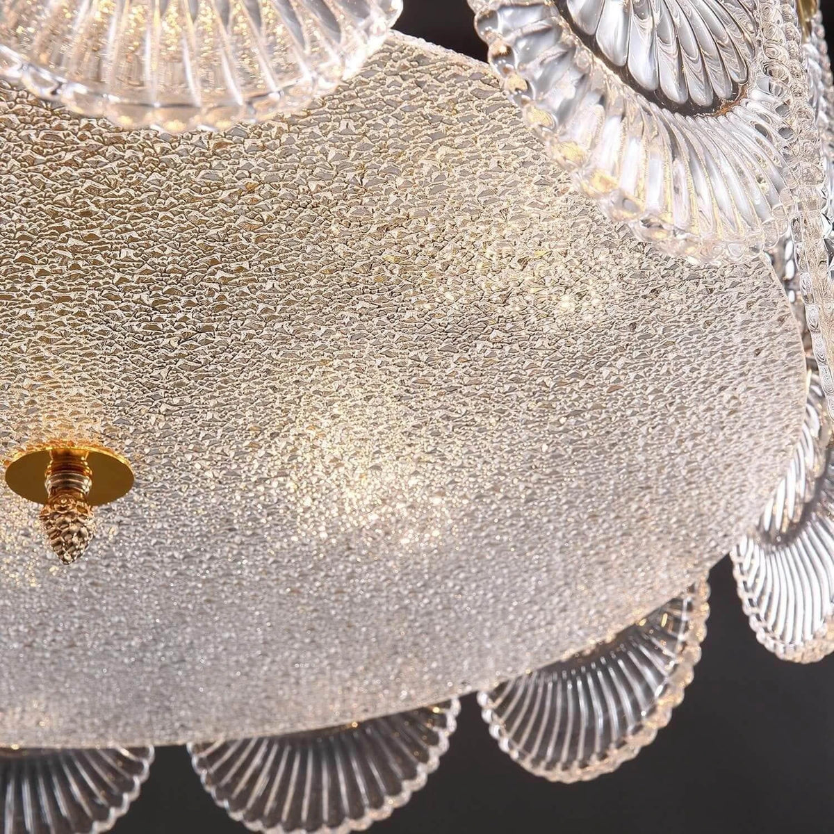 Bottom Up View of Illuminated Faceted Glass Ceiling Light and Ceiling Patterns