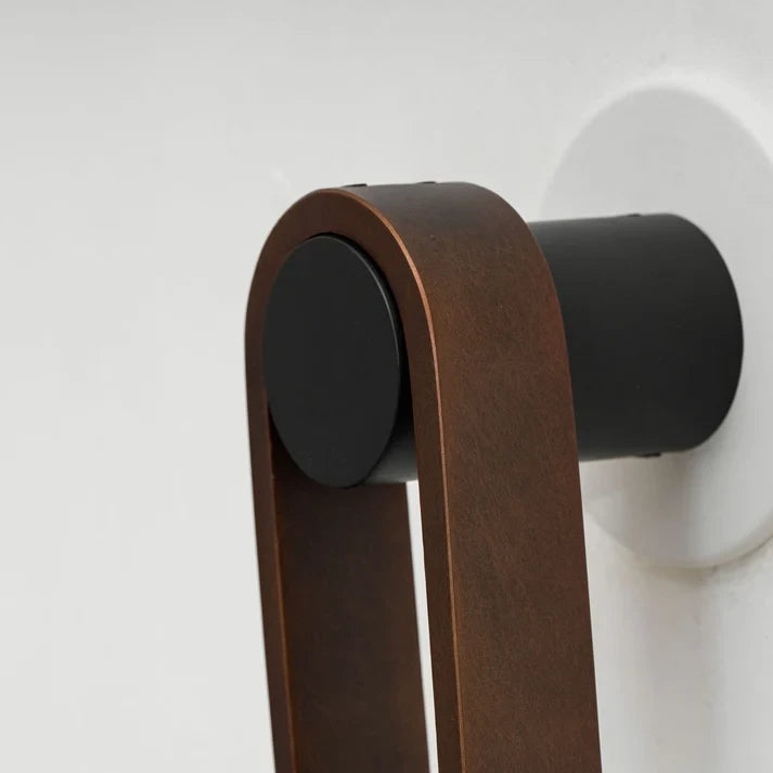 Close Up View of Leather Strap Mounting Hardware and Wall Bracket