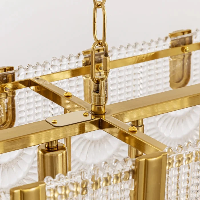 Close Up View of Brass Canopy and Chain on Linear Chandelier