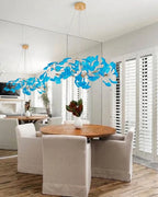 Modern Blue Art Glass Chandelier Over Round Dining Table