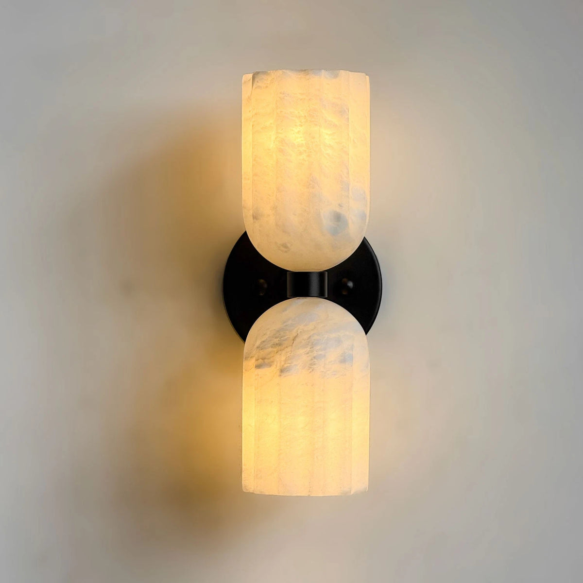 Illuminated Modern Double Alabaster Wall Sconce with Black Hardware Studio Display