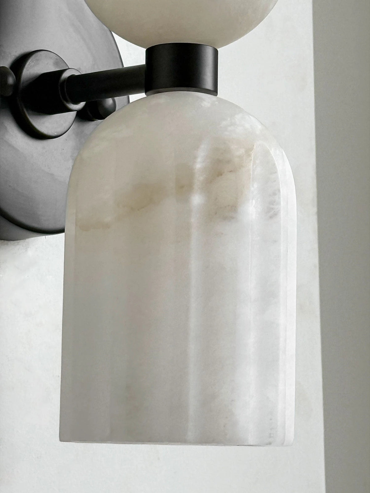 Close Up View of Black Hardware and Alabaster Cylinder Shade