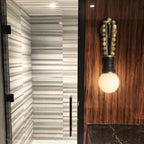 Modern Minimalist Wall Sconce in Wooden Corridor Setting