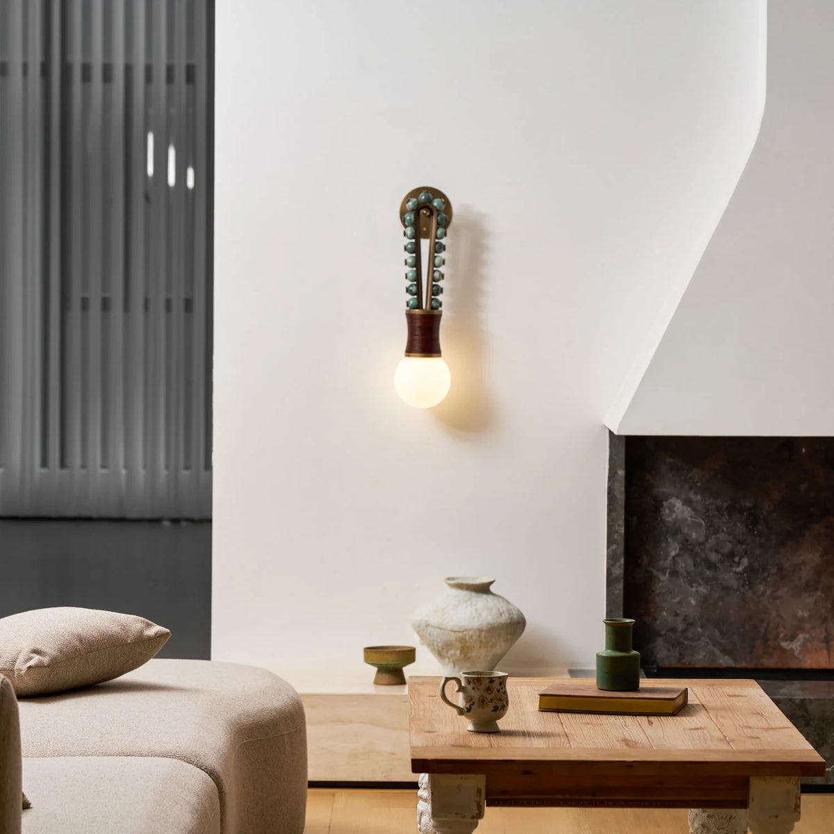 Modern Brass Bead Wall Sconce in Contemporary Living Room