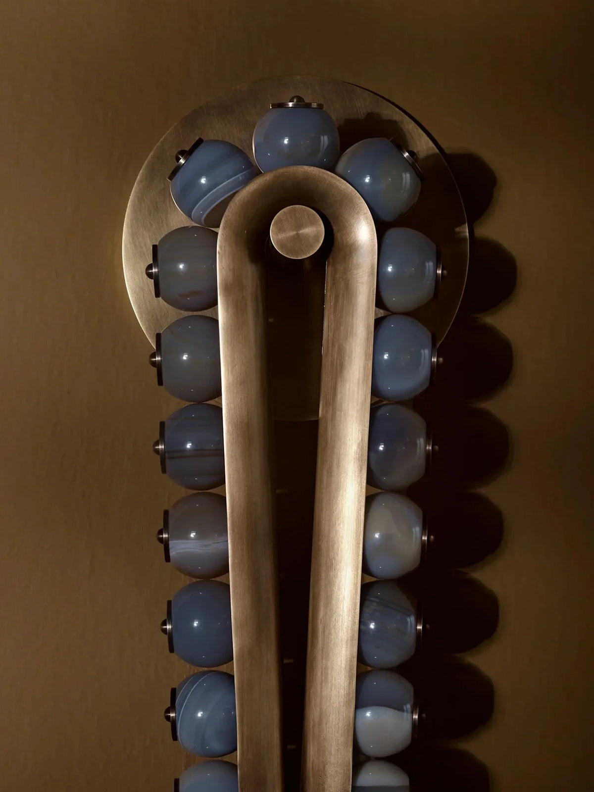 Close Up View of Green Beads and Brass Frame Connection Details