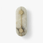 Modern Alabaster Oval Wall Sconce on Pure White Background