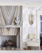 Modern Alabaster Wall Sconce Beside Fireplace Setting