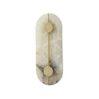 Modern Alabaster Oval Wall Sconce with Brass Linear Accents on Pure White Background