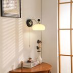 Vintage Glass Shade Wall Sconce Over Wooden Table Nook