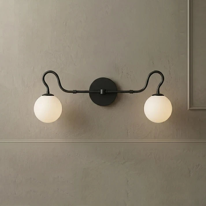 Front View of Illuminated Modern 2-Light Globe Vanity Light with Black Finish