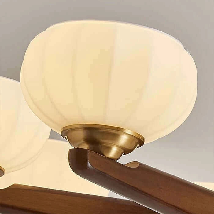 Close Up View of Pleated Glass Shade and Brass Fixture Hardware