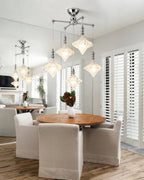 Modern Multi-Light Glass Chandelier Over Round Dining Table