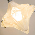 Close Up View of Diamond Faceted Art Glass Shade and Internal Bulb