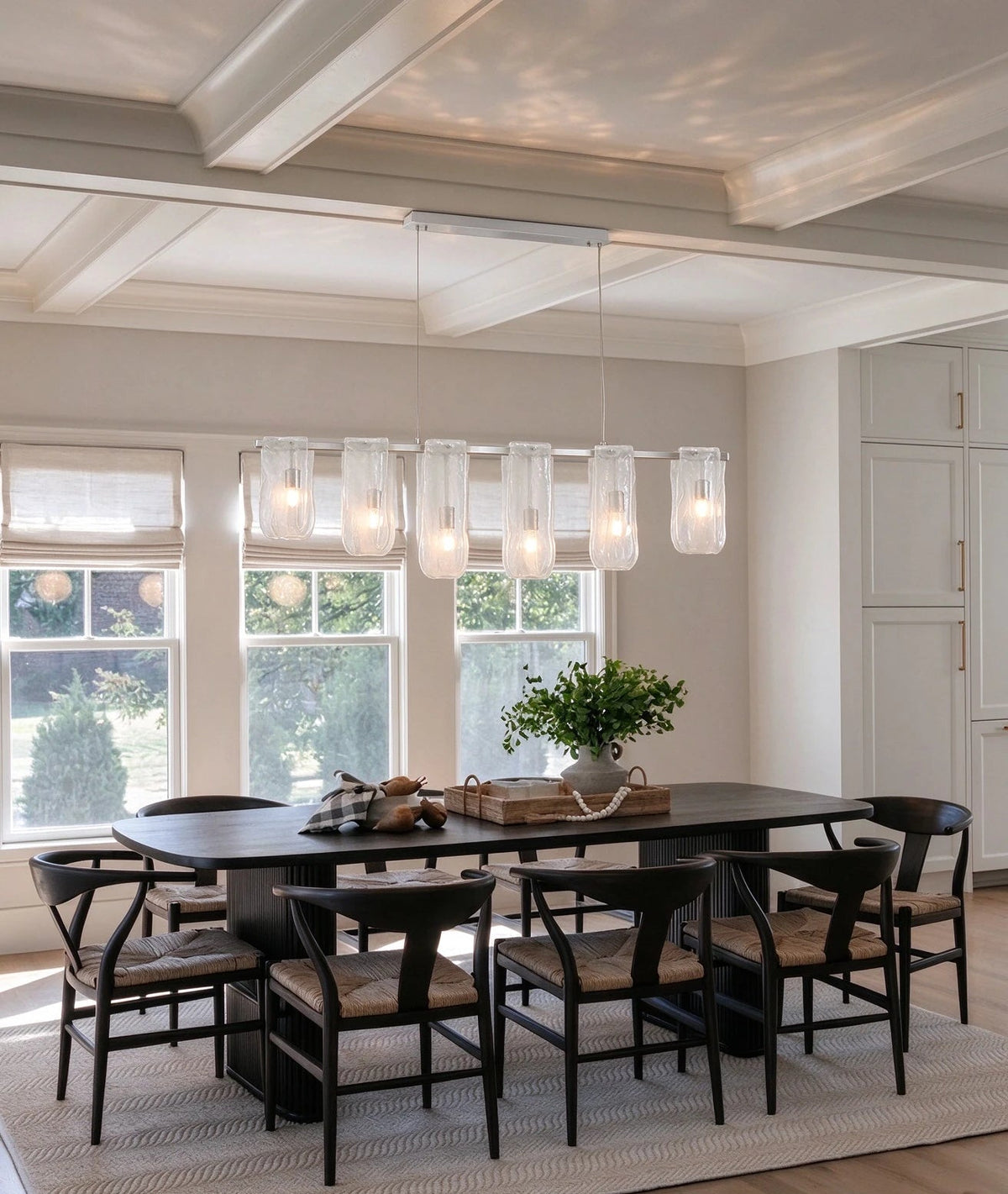 Modern Linear Glass Chandelier in Bright Dining Space