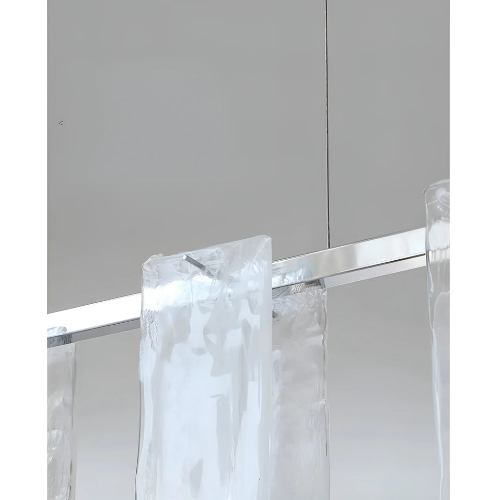 Close Up View of Linear Glass Shades and Metal Rod Connection