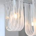 Close Up View of Illuminated Linear Glass Chandelier Studio Shot