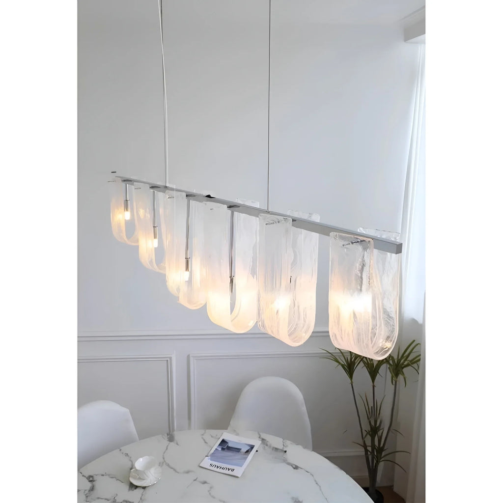 Modern Linear Glass Pendant Light Over Dining Table Setting