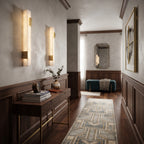 Linear Alabaster Sconces Lighting a Modern Hallway