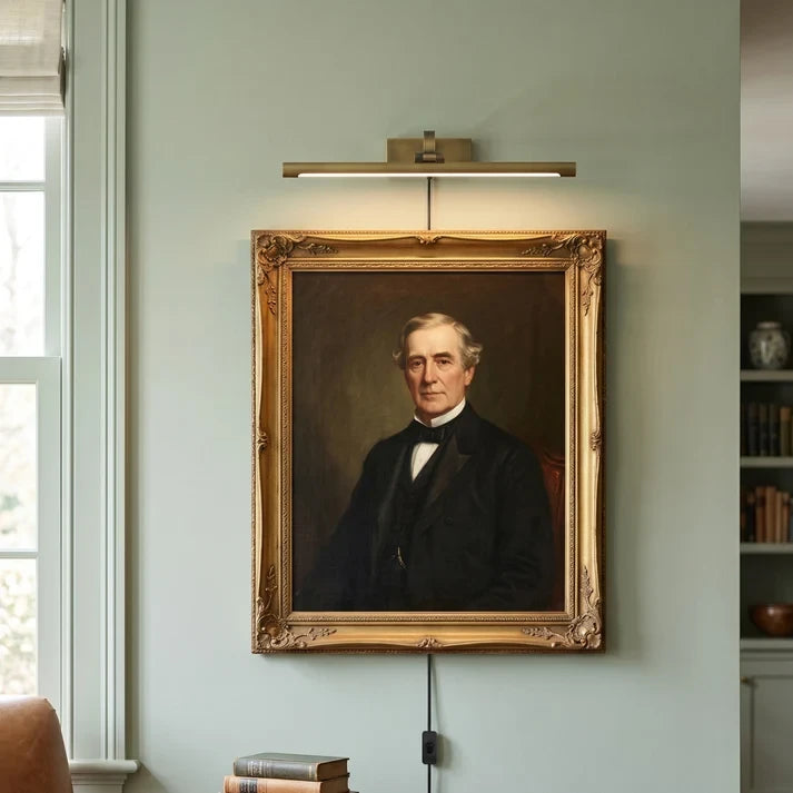 Traditional Brass Picture Light Over Portrait in Gallery Wall