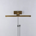 Side View of Illuminated Modern Brass Wall Sconce Studio Shot