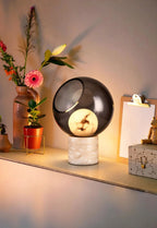 Modern Marble Base Smoked Grey Sphere Table Lamp in Cozy Interior Setting