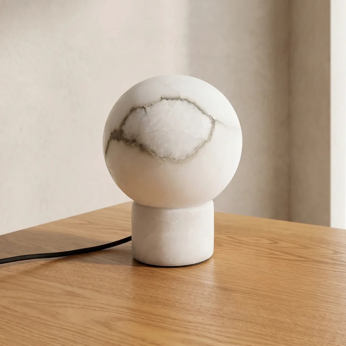 Illuminated Modern Round Base Alabaster Sphere Table Lamp Studio Shot on Dark Background