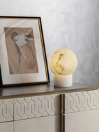 Modern Round Base Alabaster Sphere Table Lamp in Contemporary Foyer Space