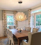 Modern Amber-White Feather Art Glass Chandelier Over Wooden Dining Table