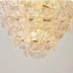 Bottom Up View of Cascading Round Plate Art Glass Chandelier and Internal Bulbs