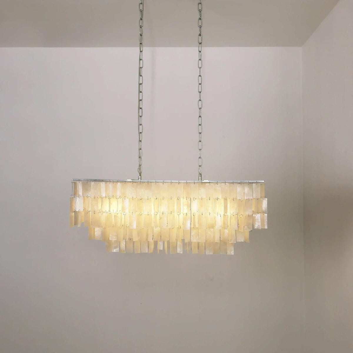 Illuminated Modern Silver Shell Art Glass Linear Chandelier Studio Shot