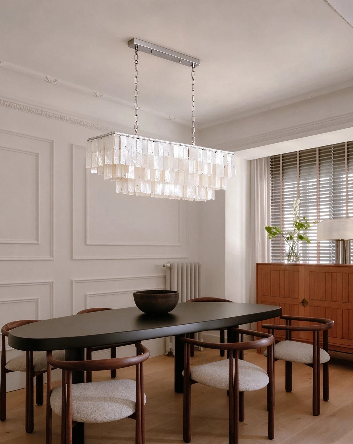 Modern Silver Shell Linear Chandelier in Minimalist Dining Room