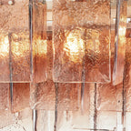 Close Up View of Pink-Amber Faceted Glass Shades and Internal Lighting
